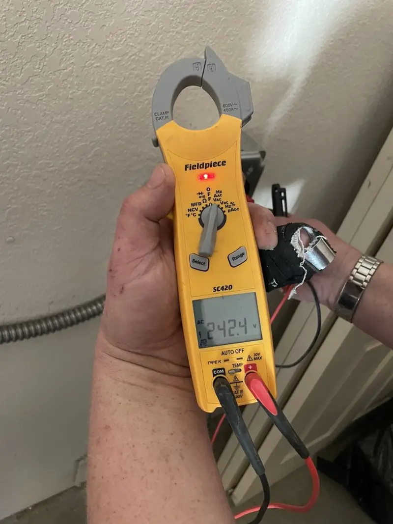 Voltage testing with clamp meter during Generator Installation in Gun Plain